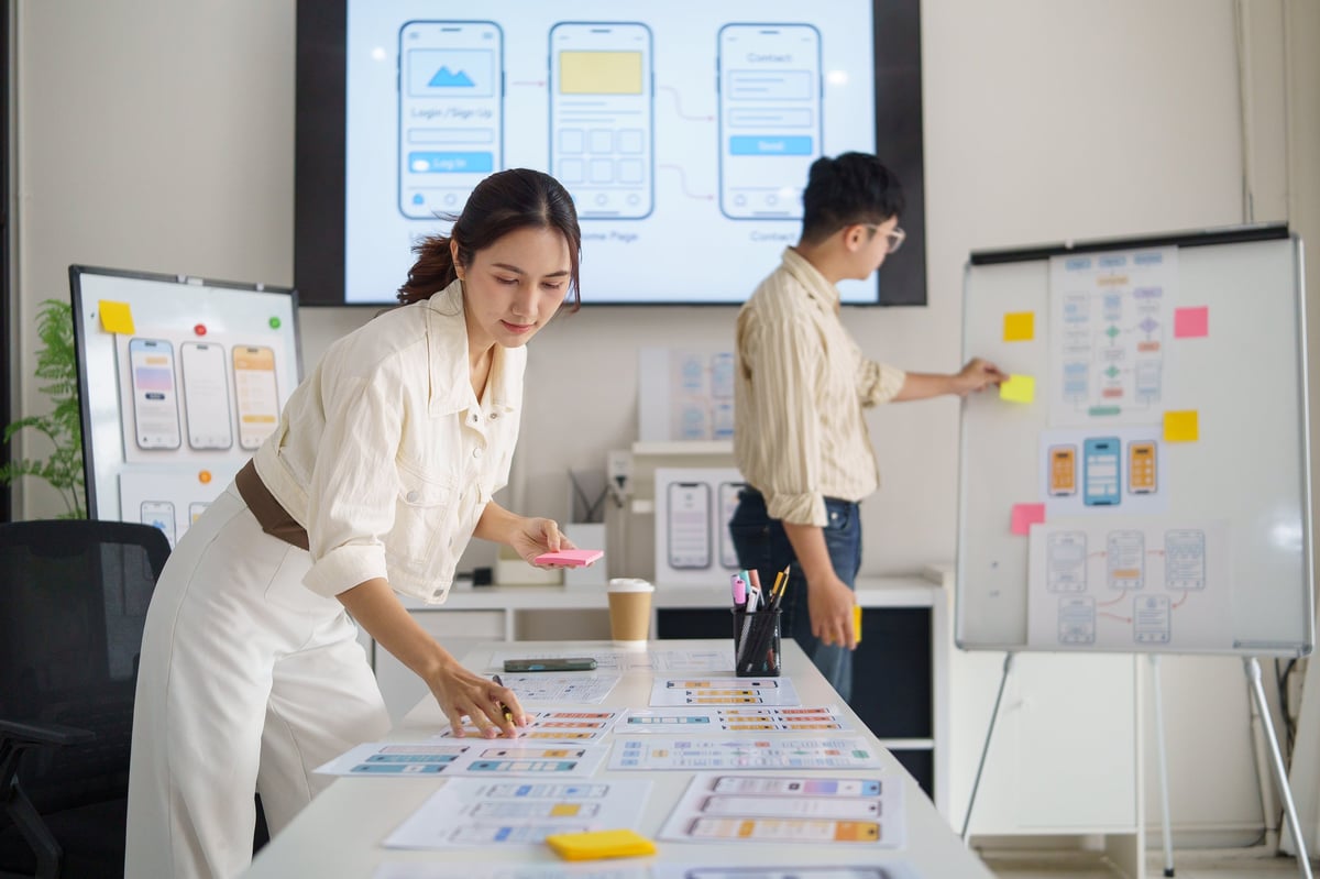 Planning notes and interface sketches on a desk